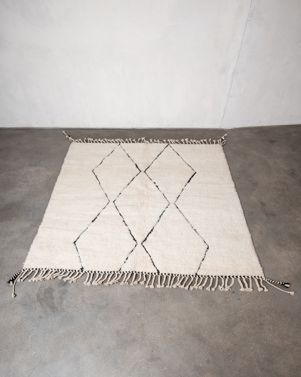 Modern, designer, handcrafted Berber rug from Morocco. Beniourain carpet with minimalist design, natural wool pile and a fluffy texture.